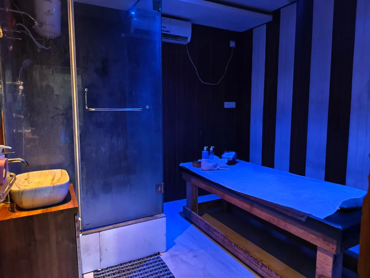 Treatment room at Diamond Wellness Spa with a glass shower cubicle